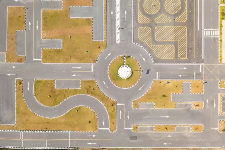 Aerial top view of a car driving test center with street. Course field, practice vehicle school.